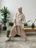 Beige wool jersey long sleeve tunic with waterproof skirt