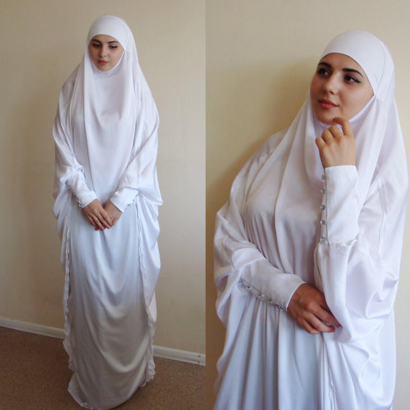 White silk long khimar with high cuffs - chic and beauty. This khimar will be a good cover for you. This outfit is good idea for engagement, hajj or wedding look! Delicate fine silk ideal for summer weather. Always keep in mind that the fabric is enlightened, at the bottom have to be the dress. An elegant way for the modest women. Buttons secure the cuffs. Be sure when ordering in the note write the length of the khimar and the girth of the wrist.We can sew khimar in any other color!