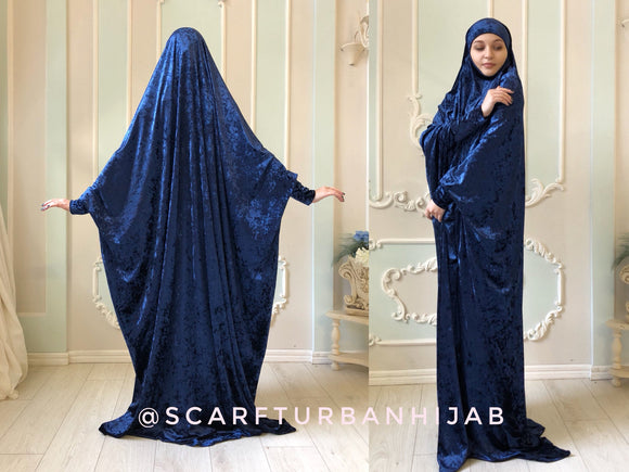 Warm collection of the traditional jilbab hijab, which is a single movement can become a niqab. You just need to lift hijab from his chin and closes face. The niqab is made of soft velvet elegant navy blue color. This khimar has a cuff that will make your hijab is not only beautiful but also convenient for the registration, running, walking.