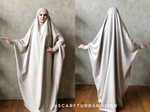 The original model of the traditional burqa hijab made by wool knitting jersey beige melange color. This jilbab has a cuff that will make your hijab is not only beautiful but also convenient for the registration, running, walking.